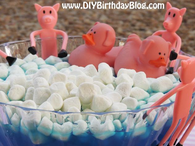 Piggy Bubble Bath Punch for a Piggy Bubble Bath Birthday Party by Free Birthday Party Printables- Rubber Ducky Pigs and Bendable Pigs In Blue Punch With Marshmallows