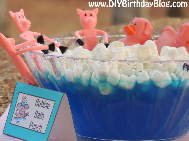 Piggy Bubble Bath Punch for a Piggy Bubble Bath Birthday Party by Free Birthday Party Printables- Rubber Ducky Pigs and Bendable Pigs In Blue Punch With Marshmallows